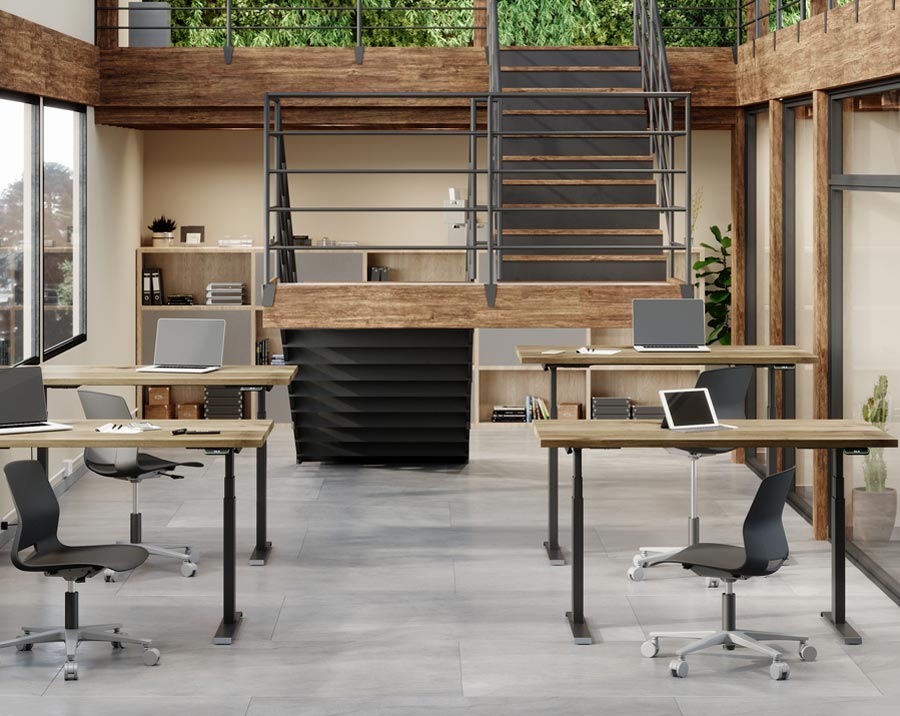 Sit Stand Desk with Solid wood top and shown at two heights in office setting.